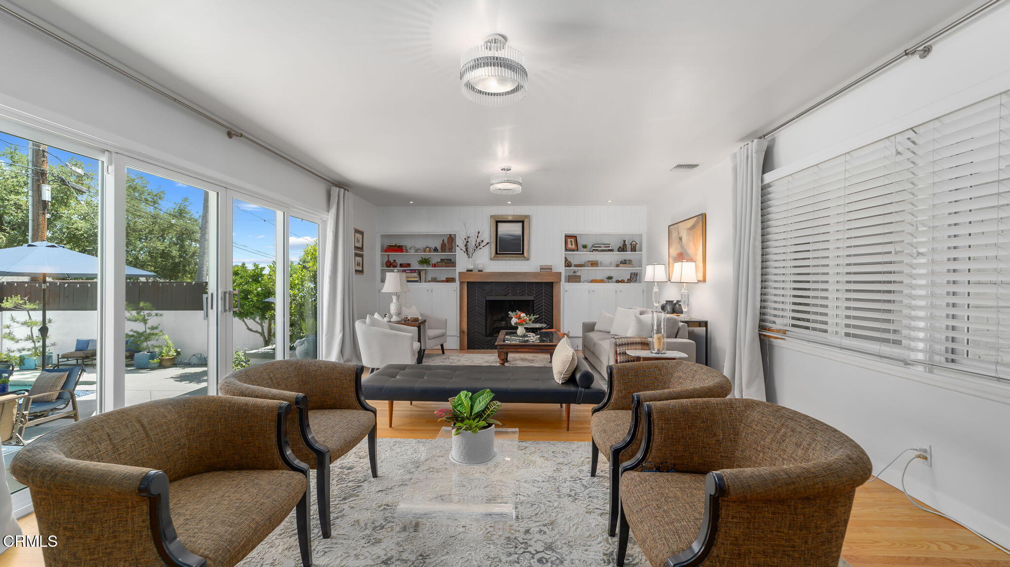 2030 North Altadena Drive Pasadena, CA 91107 - Photo 5 of 61 a living room with furniture a large window and a fireplace