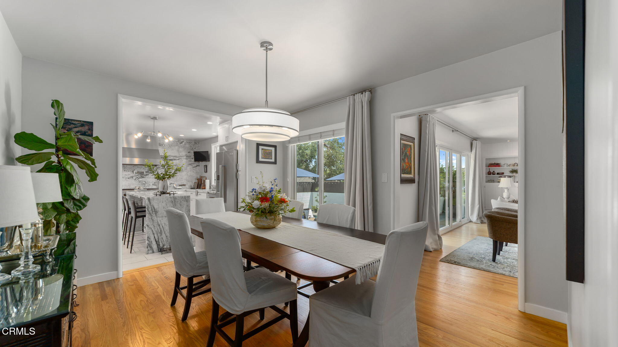 2030 North Altadena Drive Pasadena, CA 91107 - Photo 10 of 61 a view of a dining room with furniture wooden floor and a chandelier