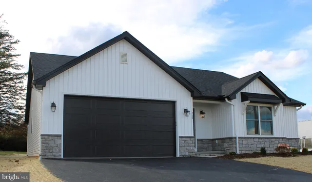 a front view of a house with garage