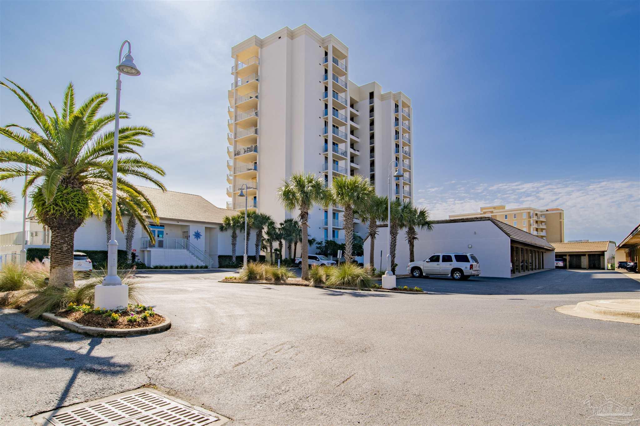 16791 Perdido Key Drive, Unit 1202A Perdido Key, FL 32507 - Photo 1 of 7 a row of palm trees in front of a building