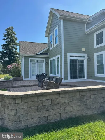 a view of house with backyard and garden