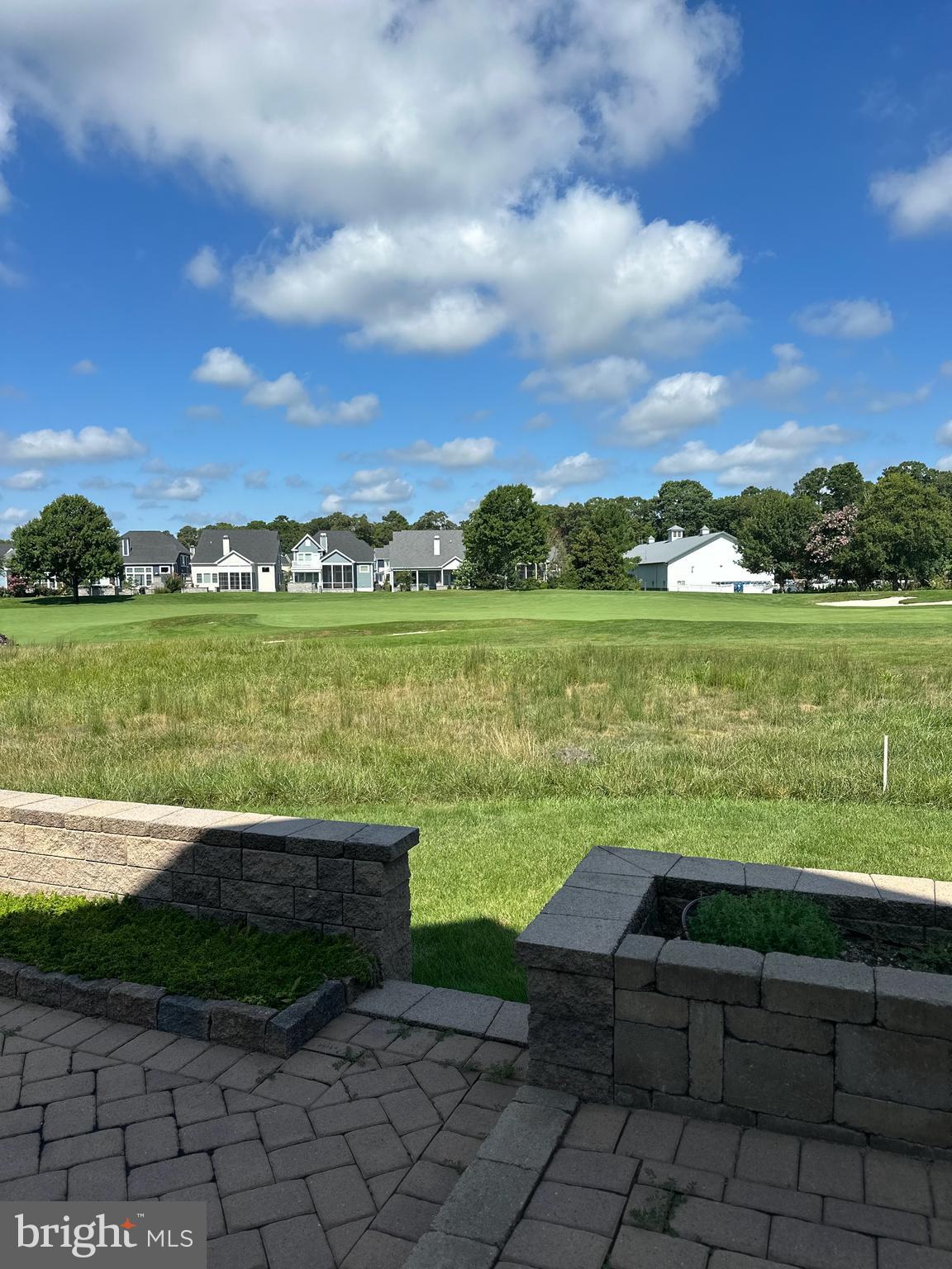 24567 Atlantic Drive Millsboro, DE 19966 - Photo 4 of 4 a view of a lake with a yard