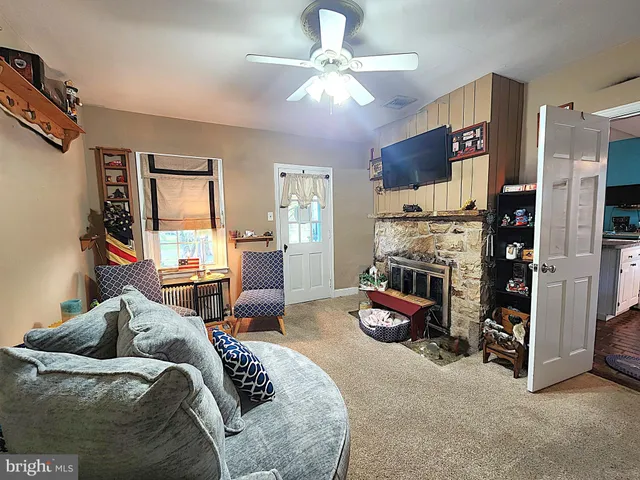 a bedroom with furniture and a chandelier