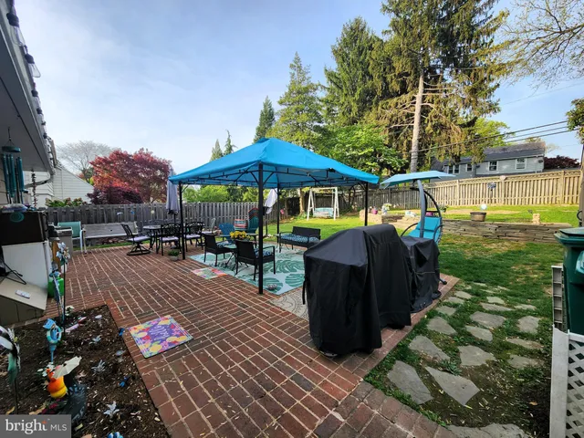 an outdoor space with pool and furniture