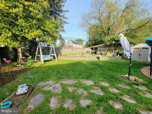 a view of a backyard with sitting area