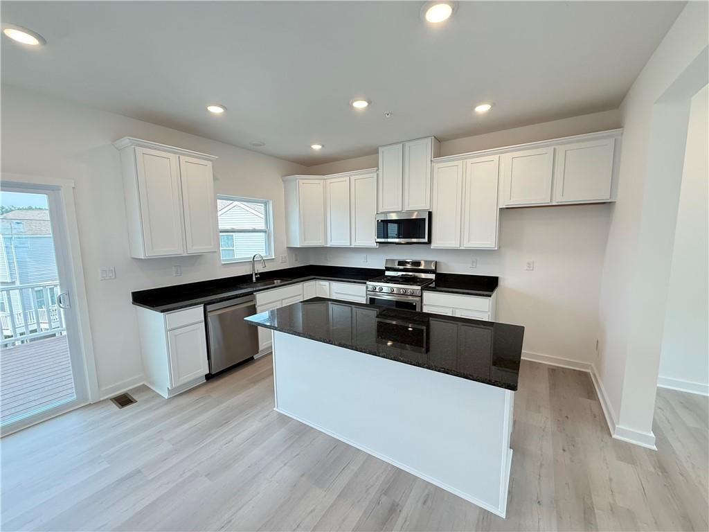 177 Lockheed Drive Coraopolis, PA 15108 - Photo 10 of 18 a kitchen with kitchen island sink stove and cabinets