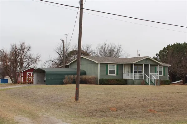a view of a house next to a yard