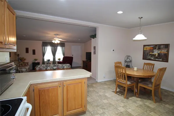 a kitchen with a table and chairs in it