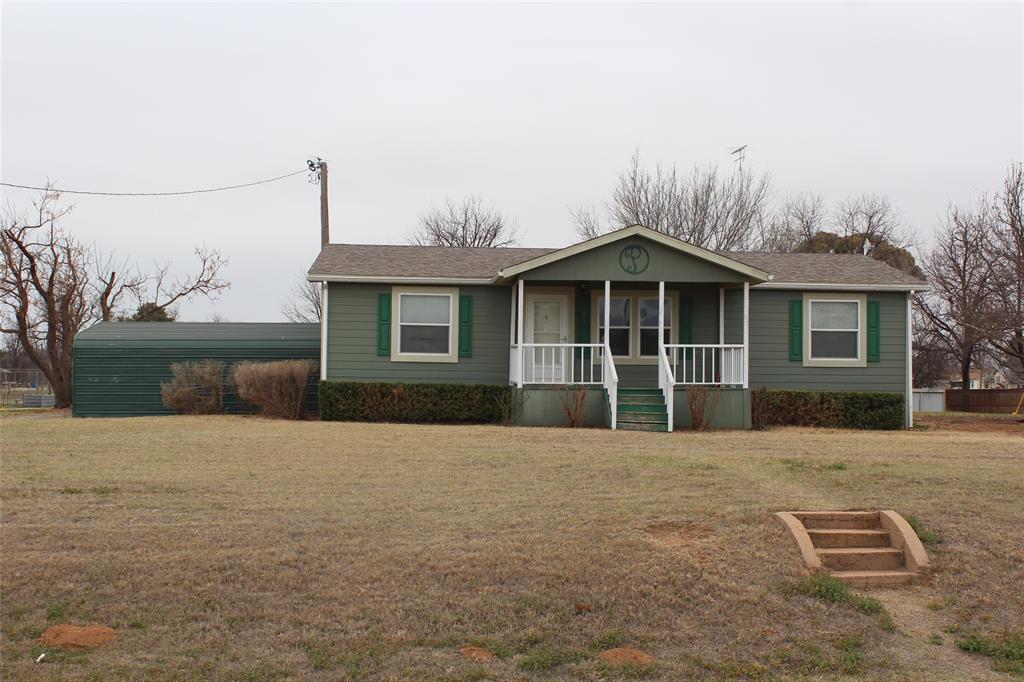601 Carothers Avenue Rochester, TX 79544 - Photo 2 of 37 a front view of a house with a garden
