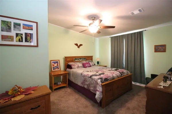 a bed room with a bed and a tv