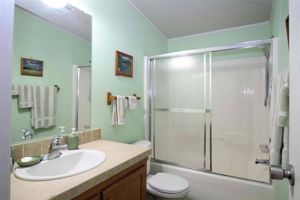 601 Carothers Avenue Rochester, TX 79544 - Photo 25 of 37 a bathroom with a sink a toilet and shower