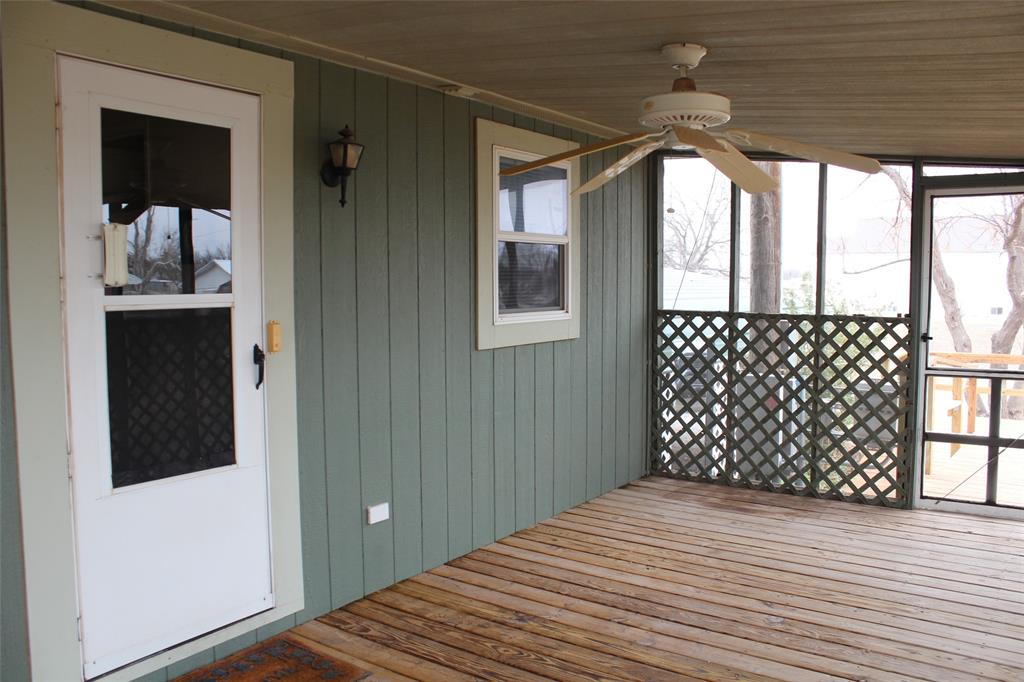 601 Carothers Avenue Rochester, TX 79544 - Photo 29 of 37 a view of a room with wooden walls and windows