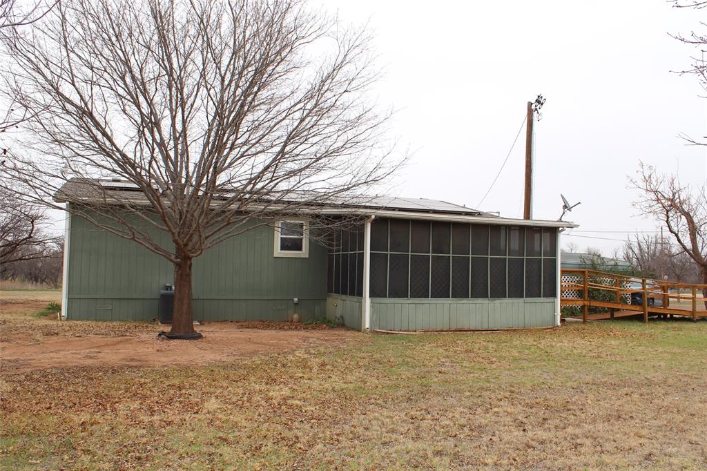601 Carothers Avenue Rochester, TX 79544 - Photo 4 of 37 a view of a house with a yard