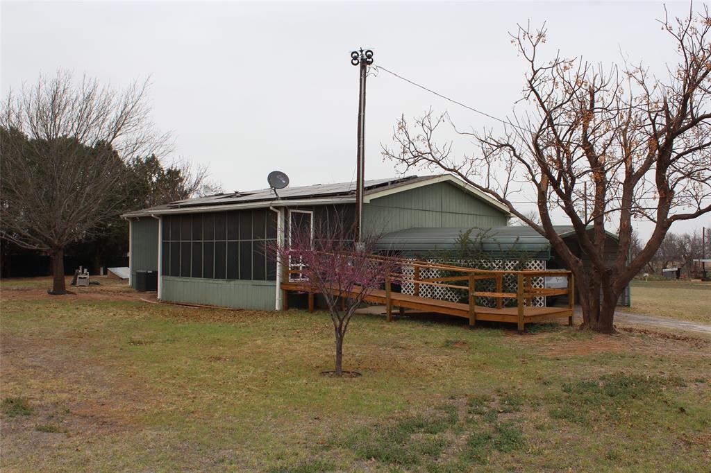 601 Carothers Avenue Rochester, TX 79544 - Photo 5 of 37 a front view of a house with a yard and garage