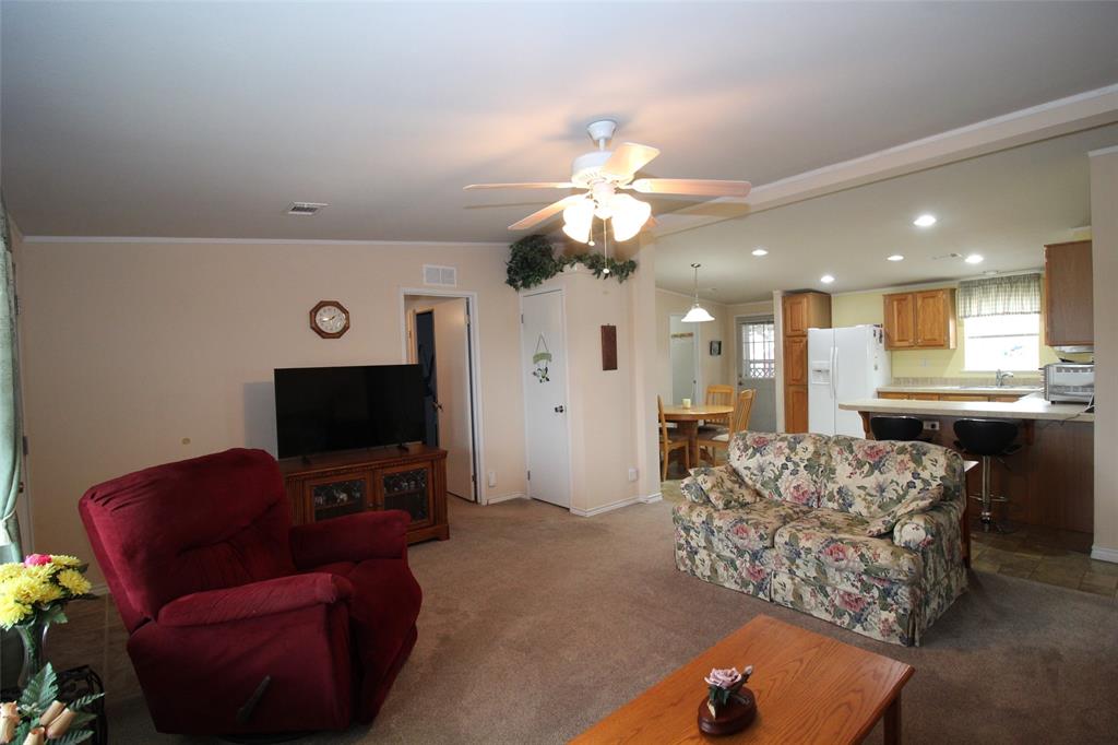 601 Carothers Avenue Rochester, TX 79544 - Photo 8 of 37 a living room with furniture and a flat screen tv