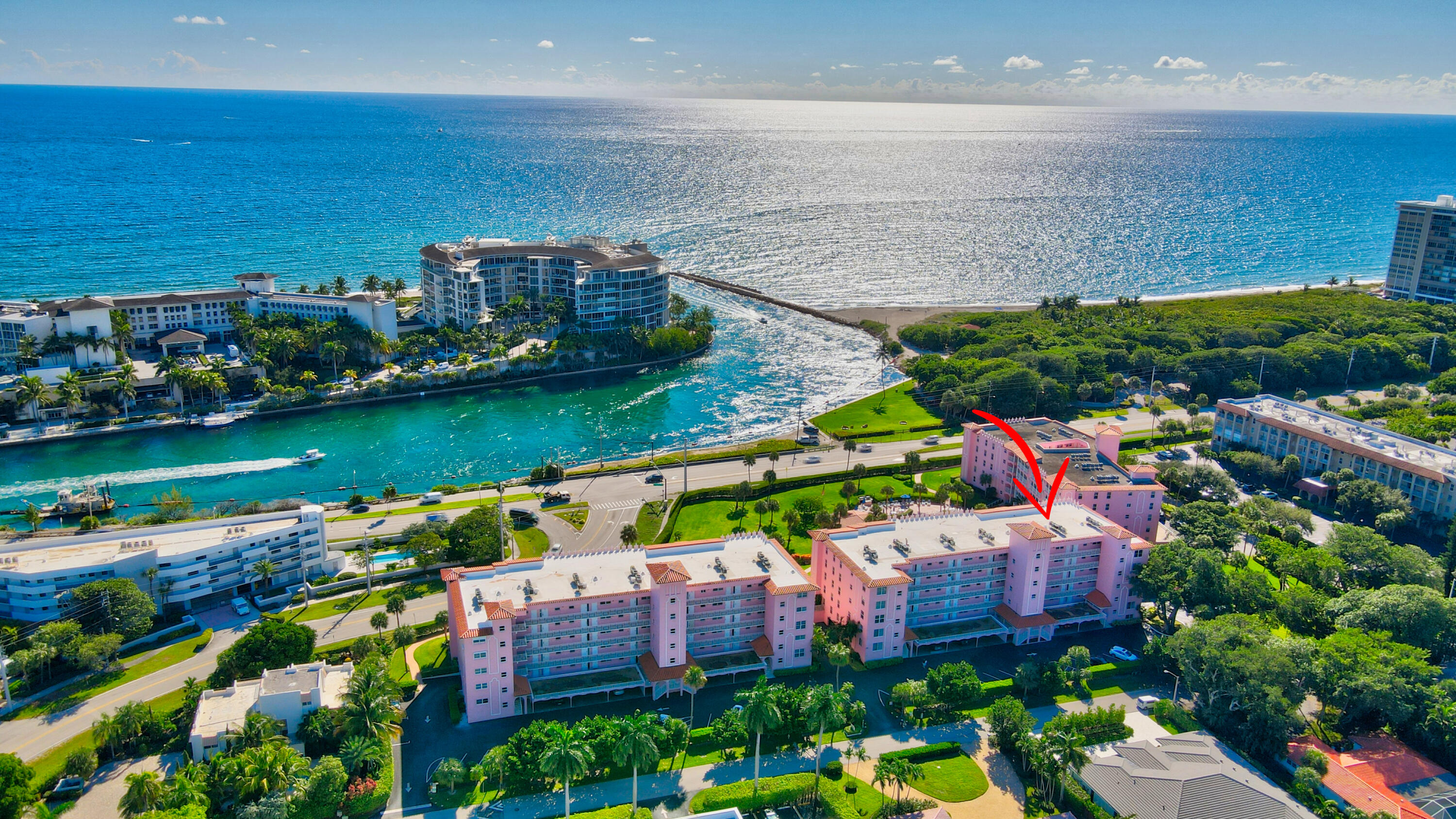 1040 Banyan Road, Unit 301C Boca Raton, FL 33432 - Photo 12 of 49 an aerial view of a city with lots of residential buildings ocean and mountain view in back