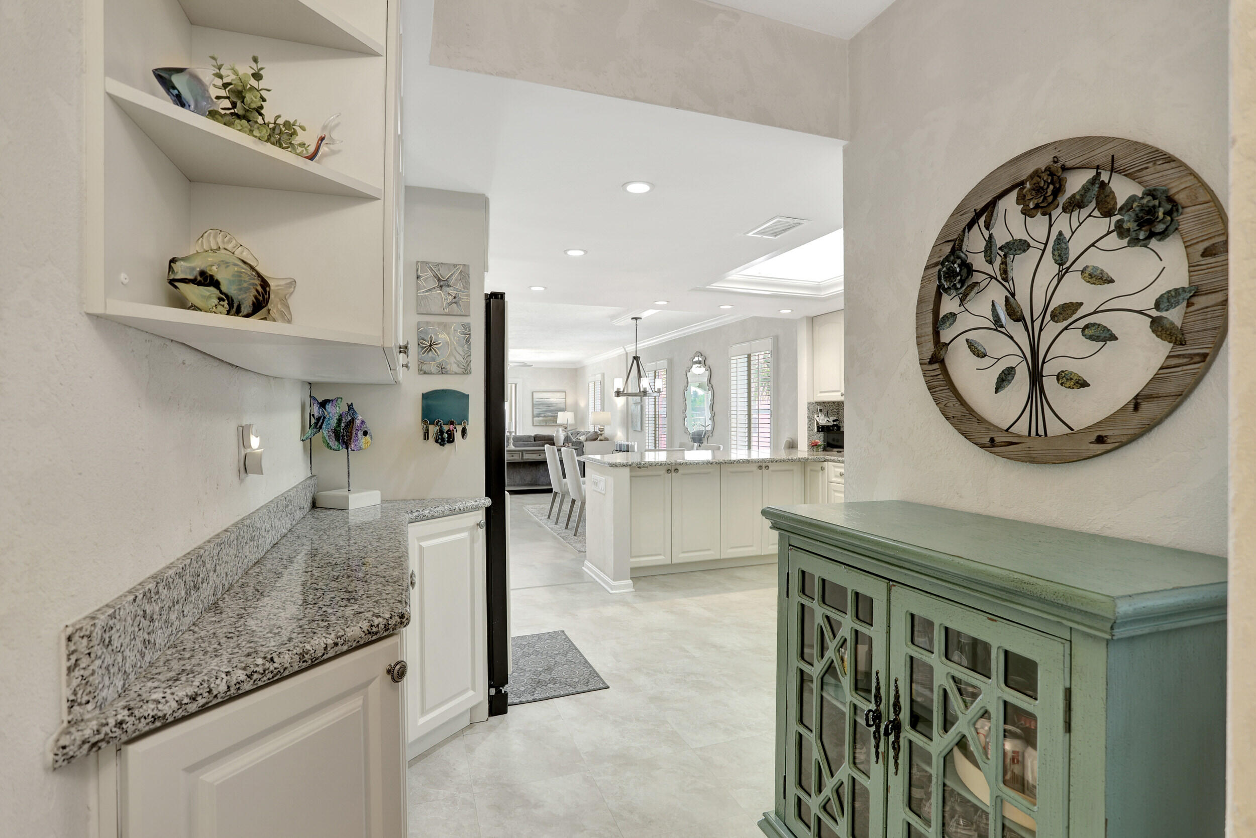 1040 Banyan Road, Unit 301C Boca Raton, FL 33432 - Photo 14 of 49 a view of a hallway with dining area
