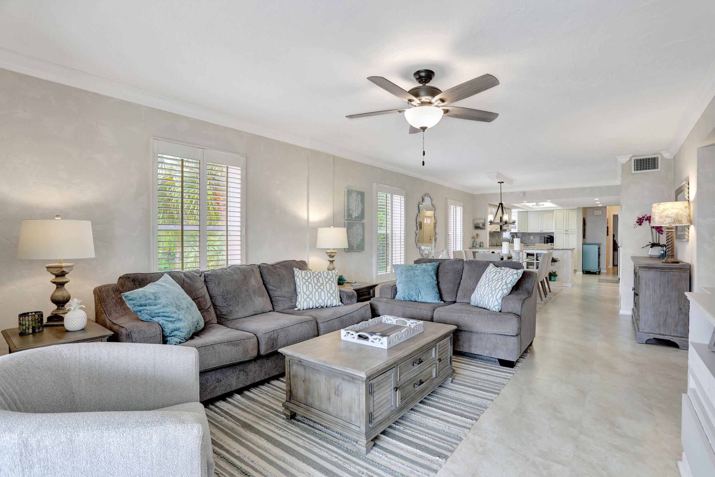 1040 Banyan Road, Unit 301C Boca Raton, FL 33432 - Photo 23 of 49 a living room with furniture and a large window