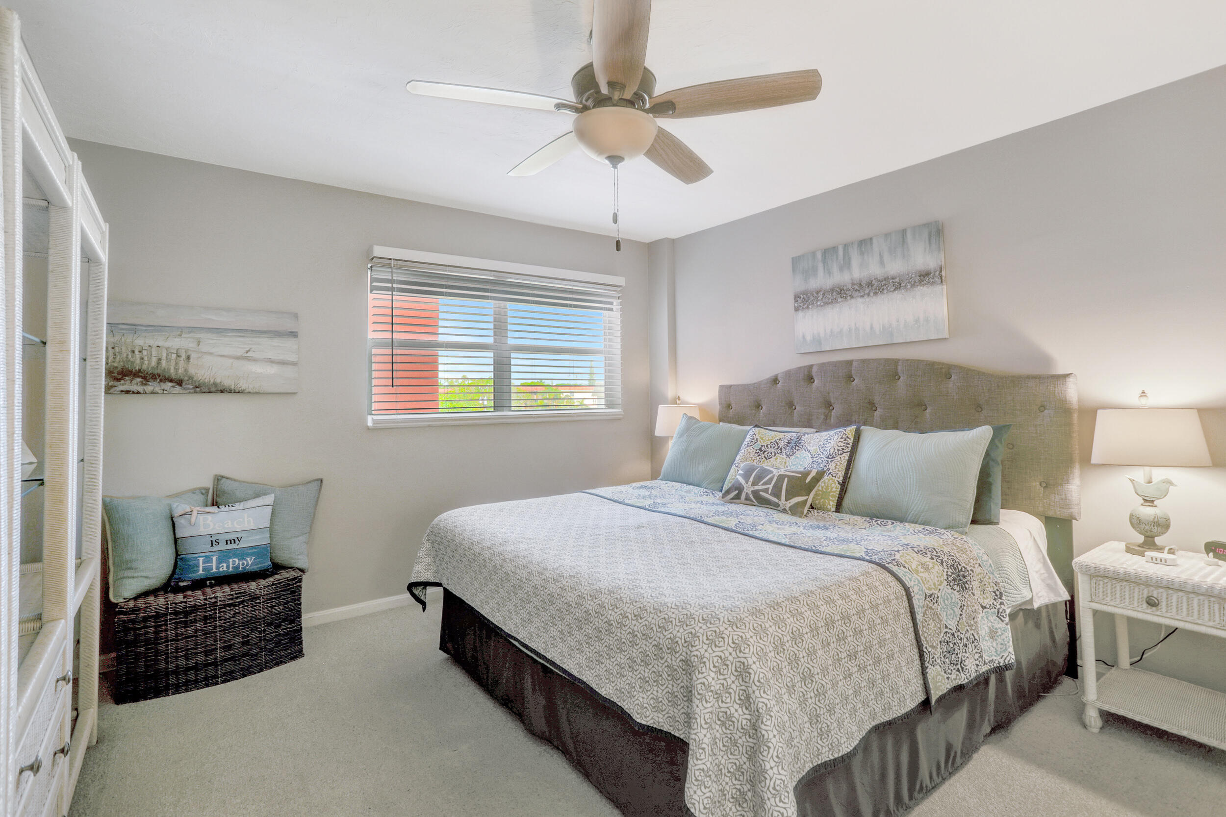 1040 Banyan Road, Unit 301C Boca Raton, FL 33432 - Photo 32 of 49 a bedroom with a bed and a chandelier