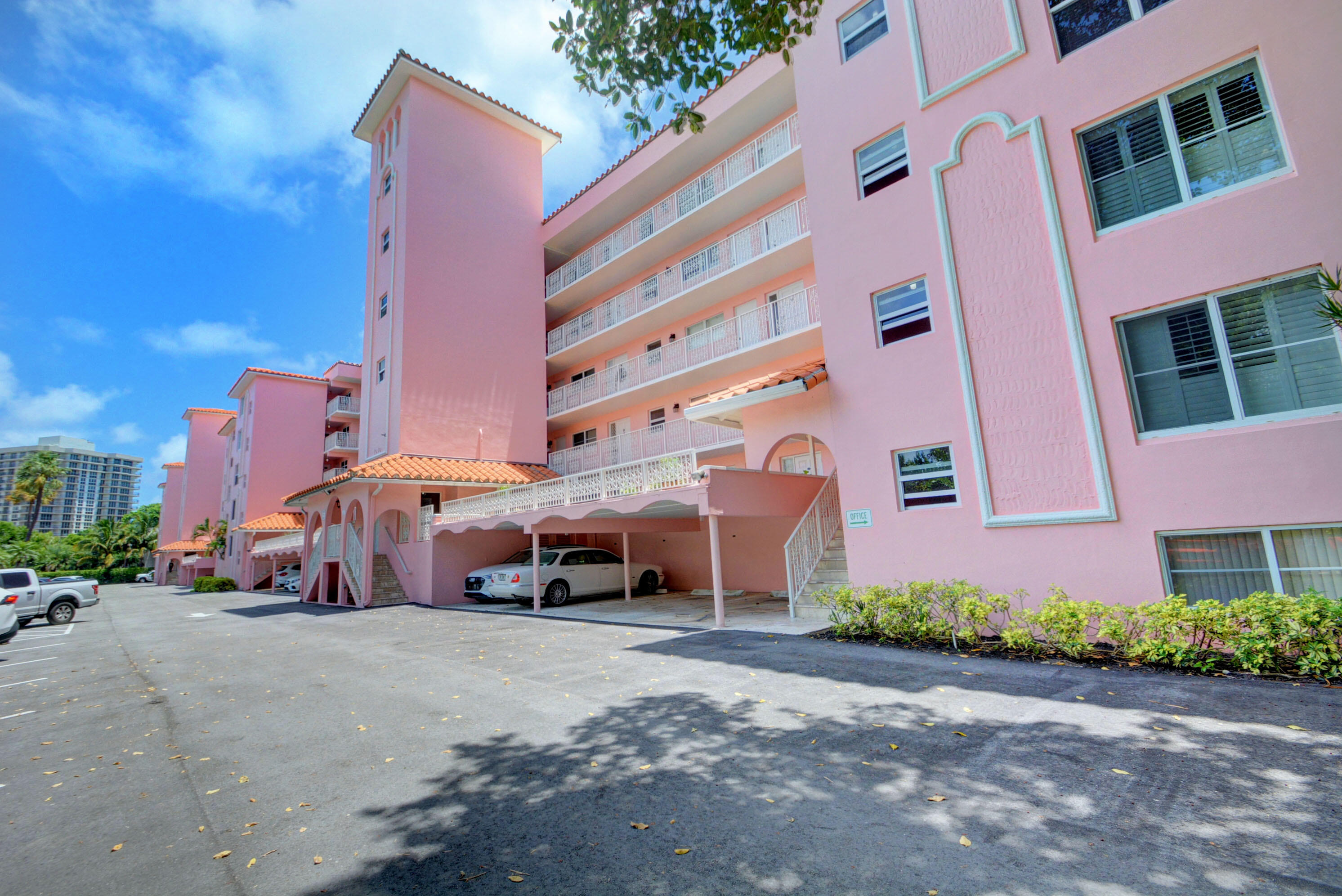 1040 Banyan Road, Unit 301C Boca Raton, FL 33432 - Photo 42 of 49 a couple of cars parked in front of a building