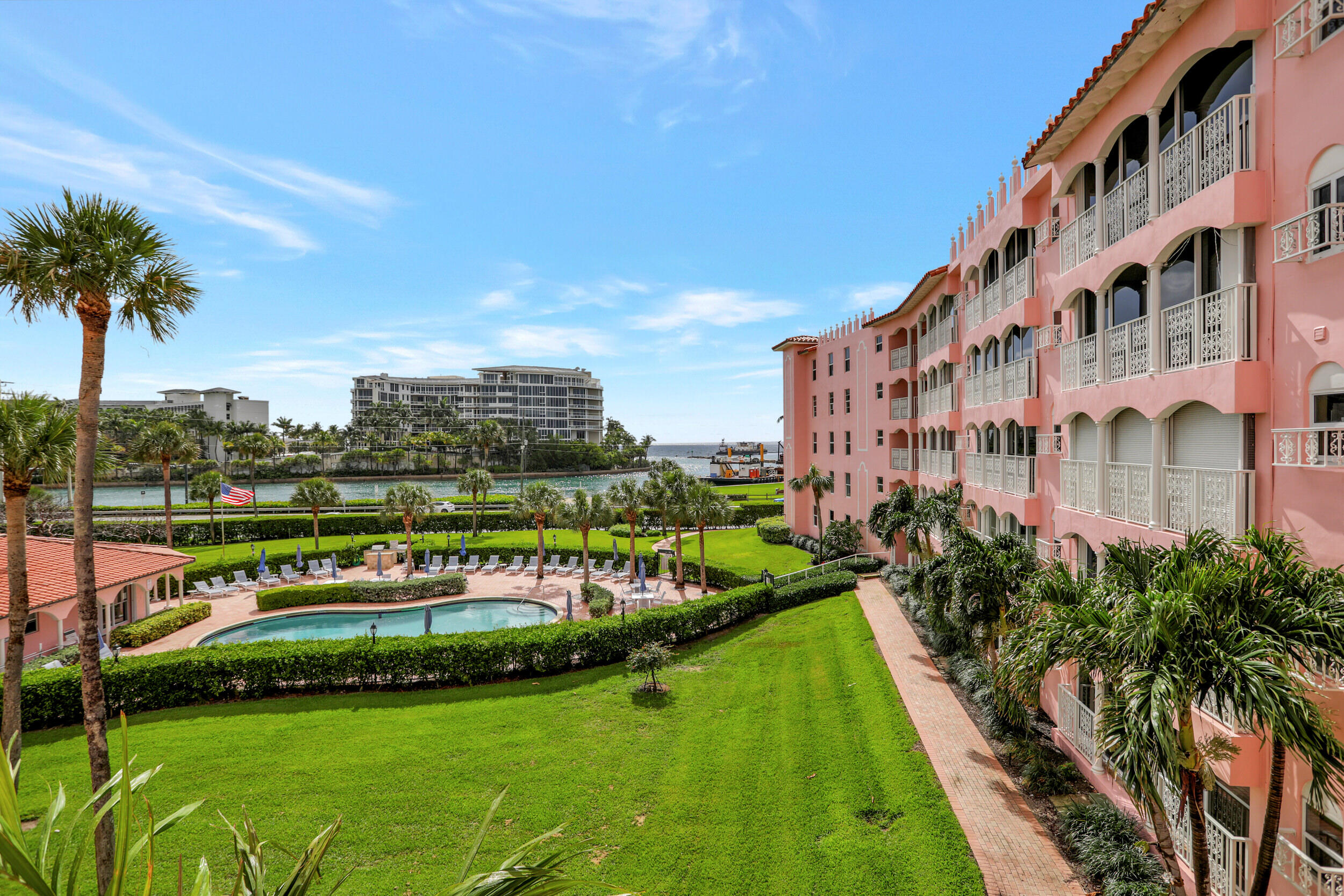 1040 Banyan Road, Unit 301C Boca Raton, FL 33432 - Photo 47 of 49 a view of a tall building with a yard