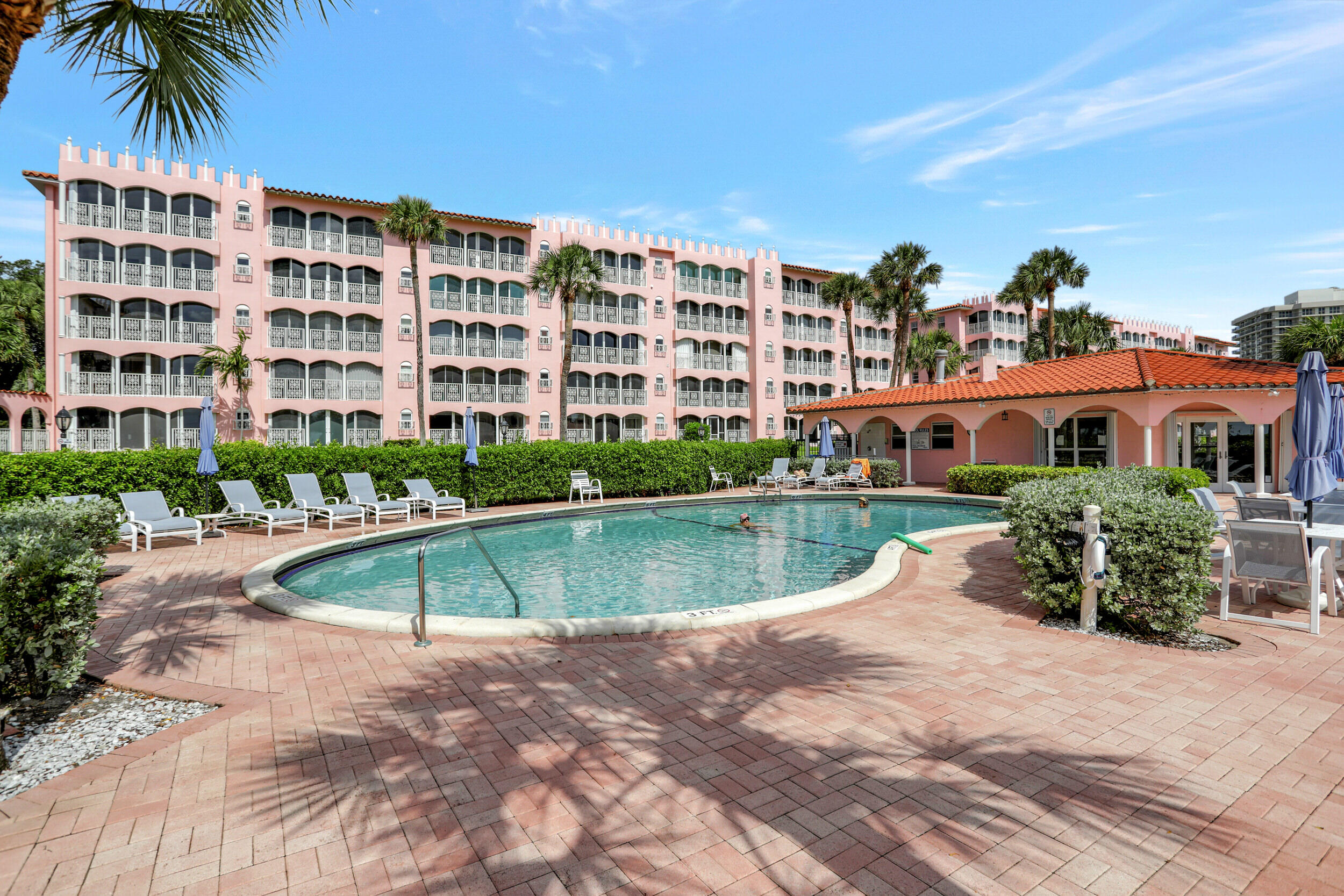 1040 Banyan Road, Unit 301C Boca Raton, FL 33432 - Photo 48 of 49 a front view of building with yard and swimming pool