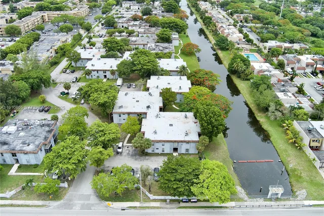 an aerial view of residential houses with outdoor space