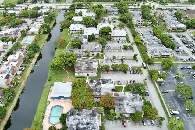 an aerial view of residential houses with outdoor space