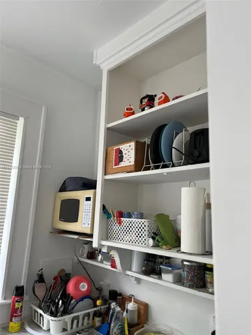 a kitchen with a sink and a window