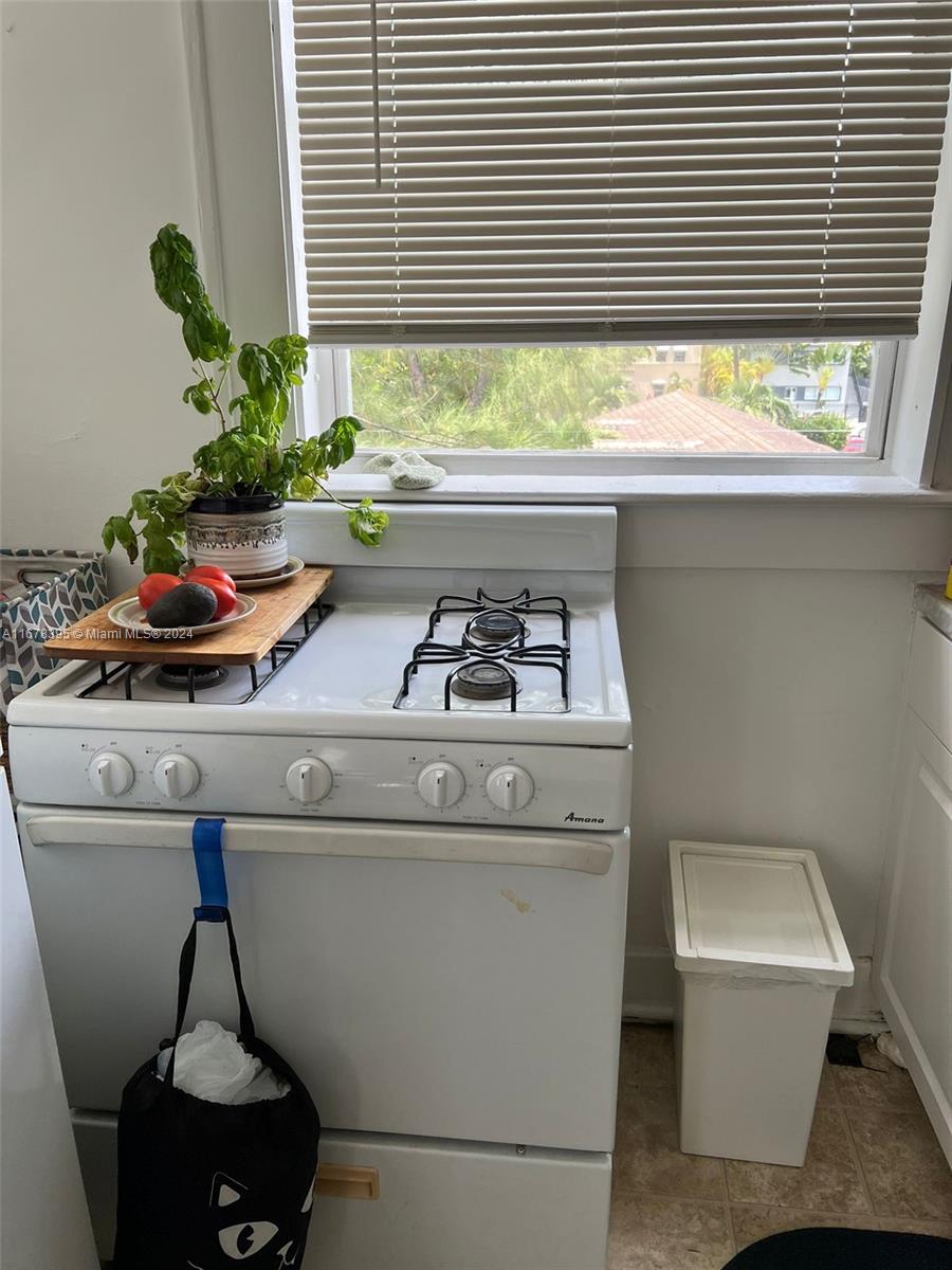 642 Michigan Avenue, Unit 29 Miami Beach, FL 33139 - Photo 6 of 12 a kitchen with a sink and a window