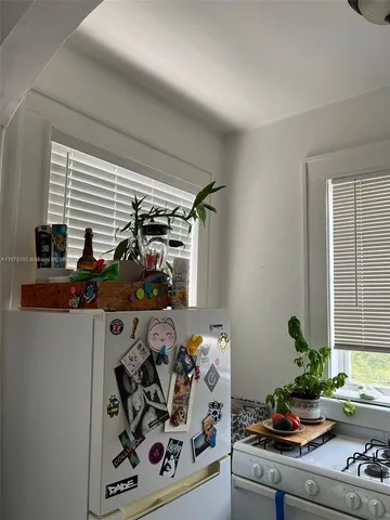 a living room with furniture and a bed
