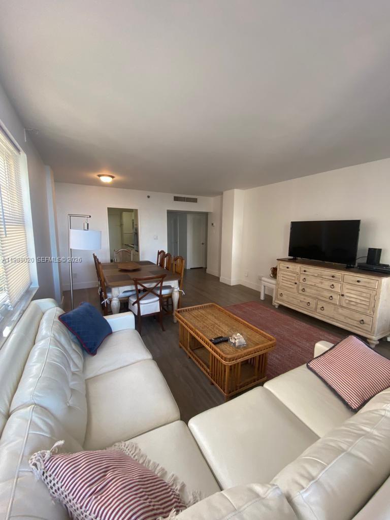 100 Lincoln Road, Unit 721 Miami Beach, FL 33139 - Photo 2 of 3 a living room with furniture and flat screen tv