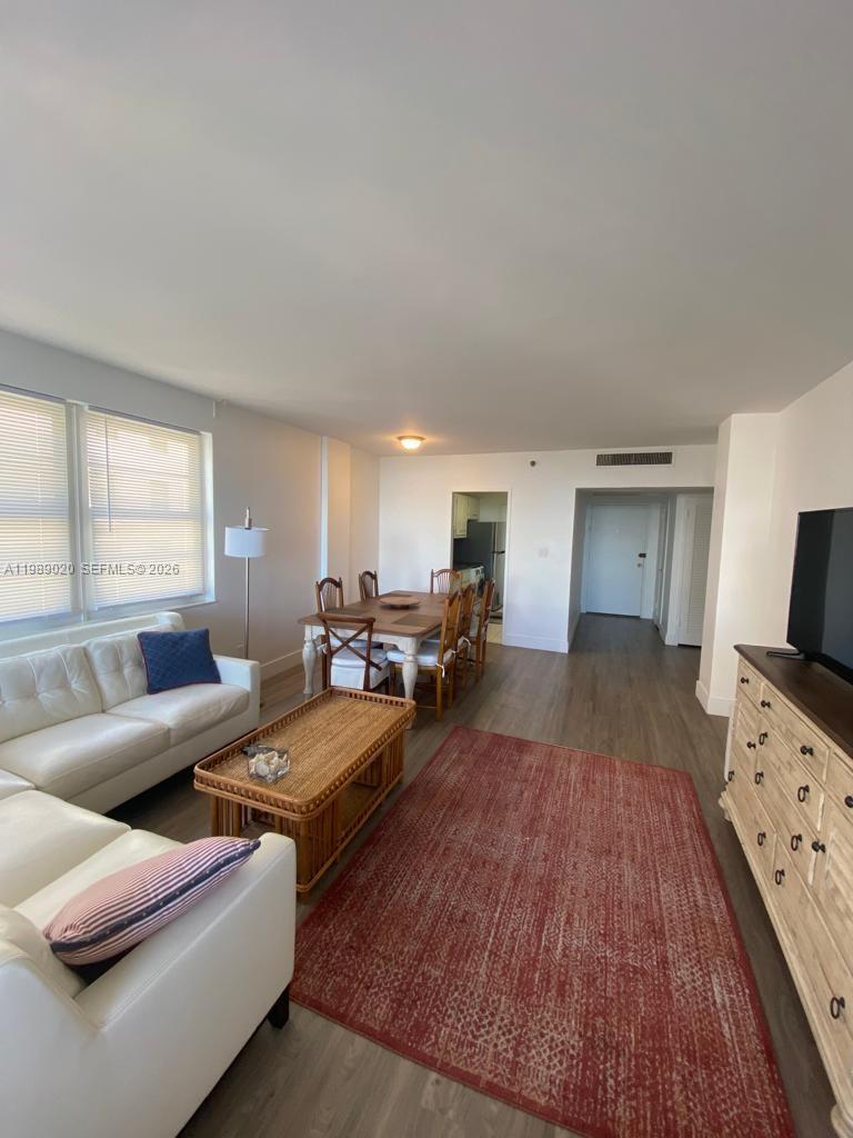 100 Lincoln Road, Unit 721 Miami Beach, FL 33139 - Photo 3 of 3 a living room with furniture and a flat screen tv