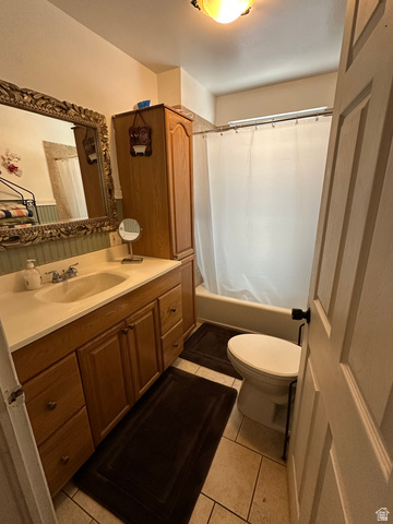 8320 West 3100th Street South Magna, UT 84044 - Photo 19 of 41 Bathroom with vanity, shower / tub combo, and light tile patterned flooring