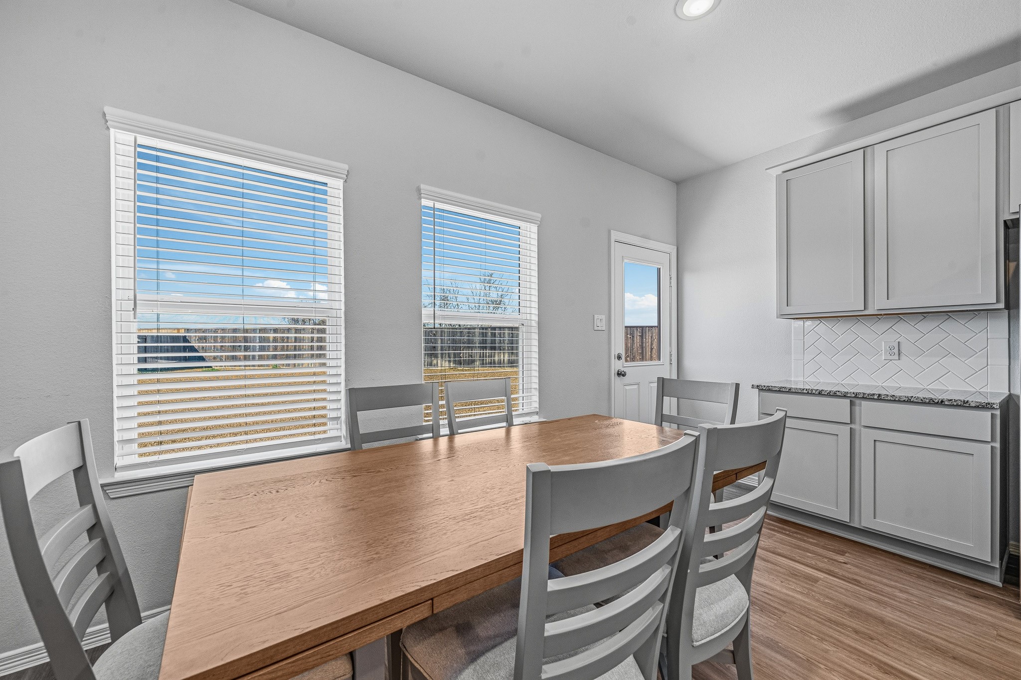 5903 Dawning Sun Road Katy, TX 77493 - Photo 14 of 37 a dining room with furniture and wooden floor