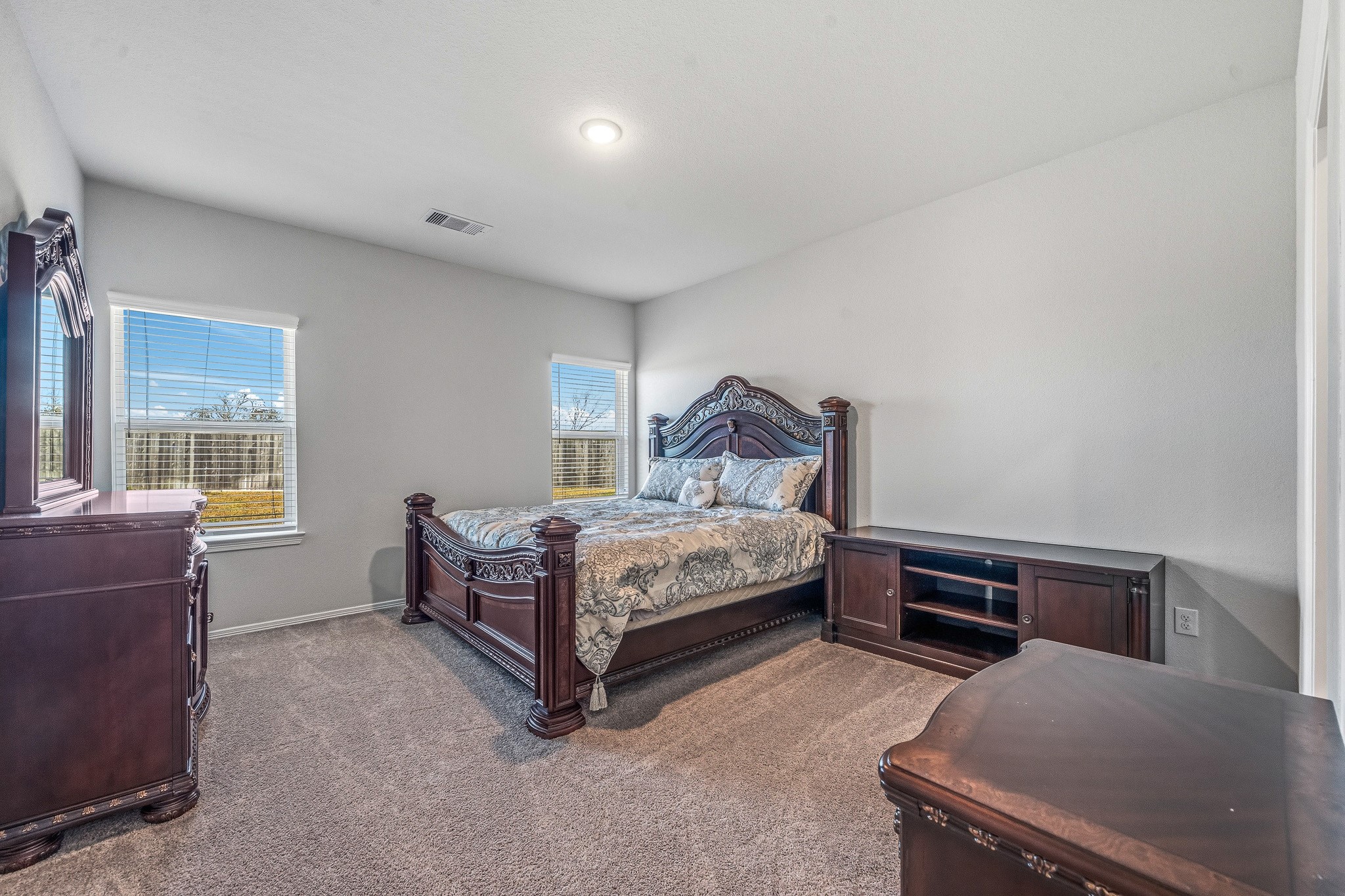 5903 Dawning Sun Road Katy, TX 77493 - Photo 15 of 37 a bedroom with a bed and windows