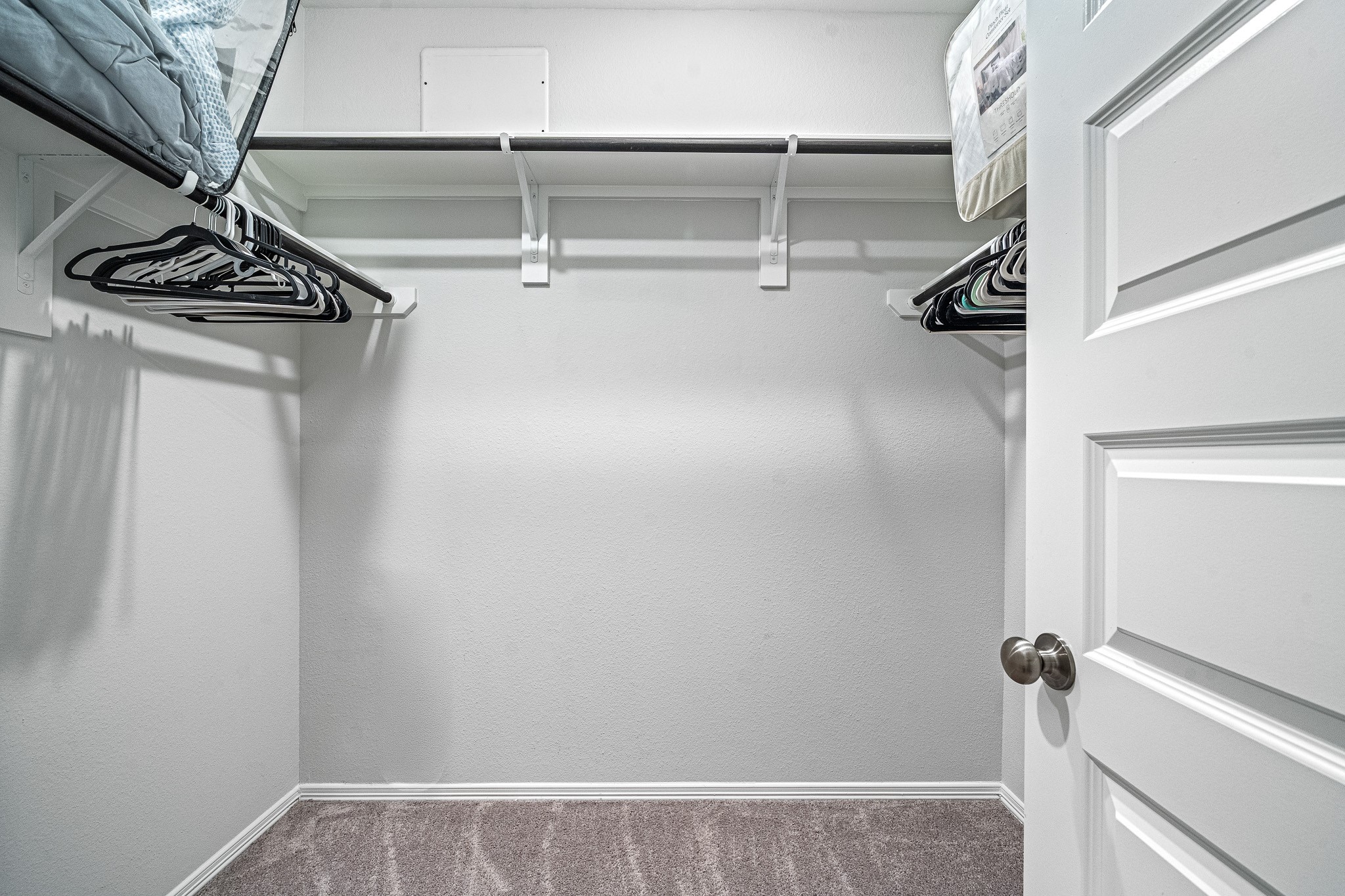5903 Dawning Sun Road Katy, TX 77493 - Photo 19 of 37 a view of walk in closet with empty racks