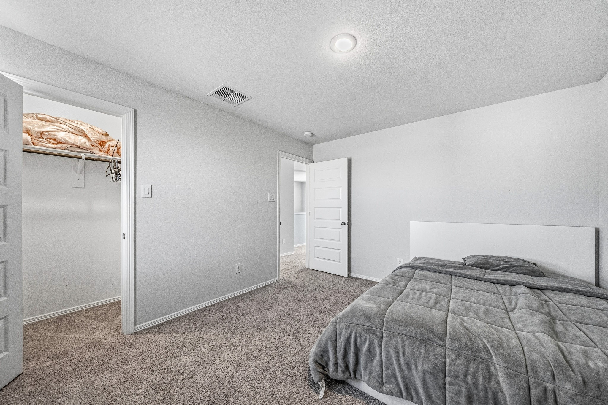5903 Dawning Sun Road Katy, TX 77493 - Photo 27 of 37 a bedroom with a bed and painting on the wall