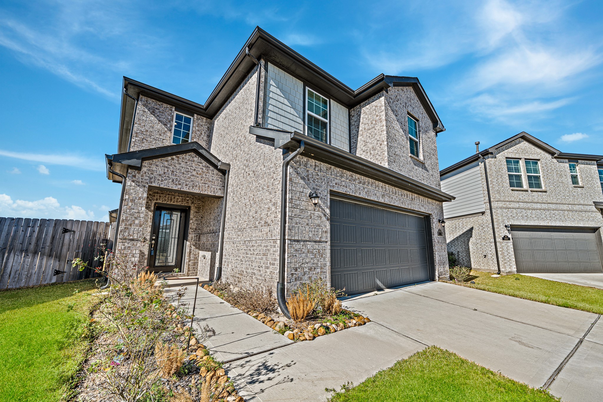 5903 Dawning Sun Road Katy, TX 77493 - Photo 4 of 37 a front view of a house with garden