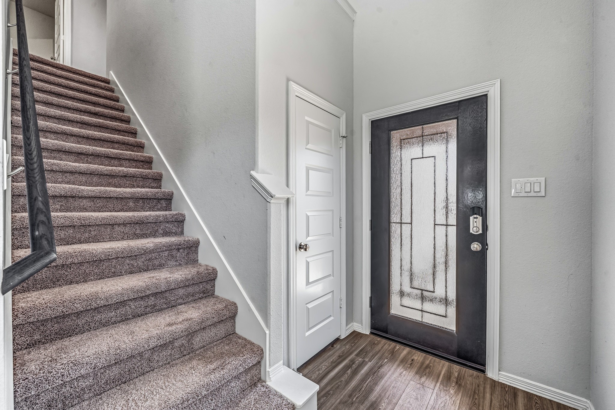 5903 Dawning Sun Road Katy, TX 77493 - Photo 8 of 37 a view of entryway with wooden floor and stairs