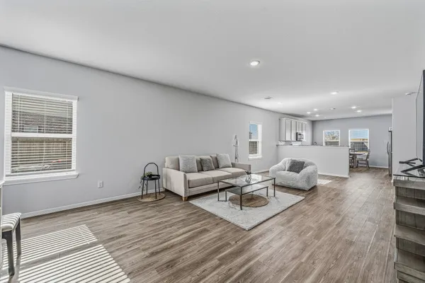 a living room with furniture and a window