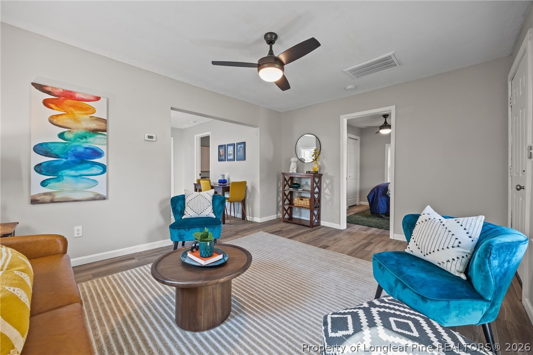 625 Eva Circle Spring Lake, NC 28390 - Photo 10 of 28 a living room with furniture and a wooden floor