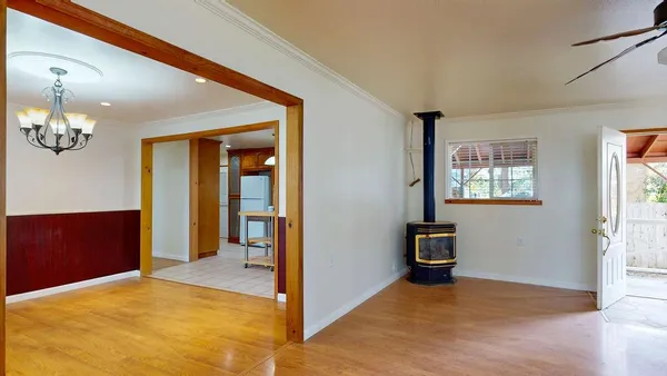 a view of an empty room with furniture