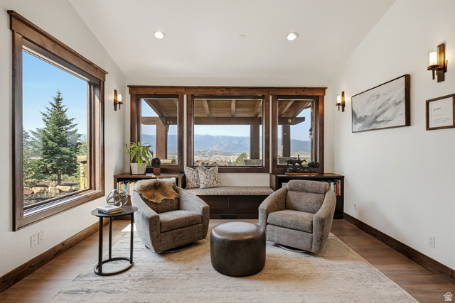 7885 North Rabbitbrush Court, Unit 13 Park City, UT 84098 - Photo 19 of 88 Interior room with expansive wood-trimmed windows offering mountain and tree scenery