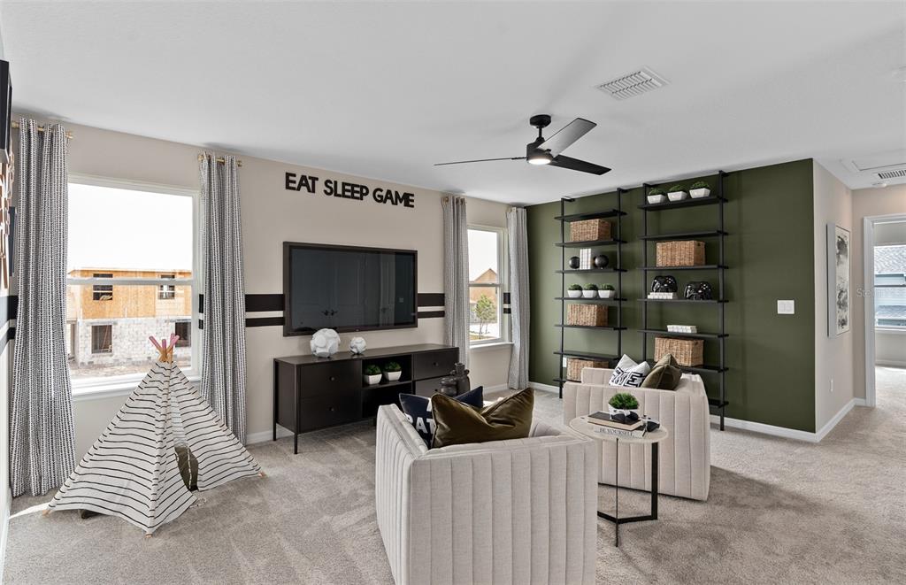 5013 Furrowed Way St. Cloud, FL 34771 - Photo 12 of 26 a living room with furniture and a flat screen tv