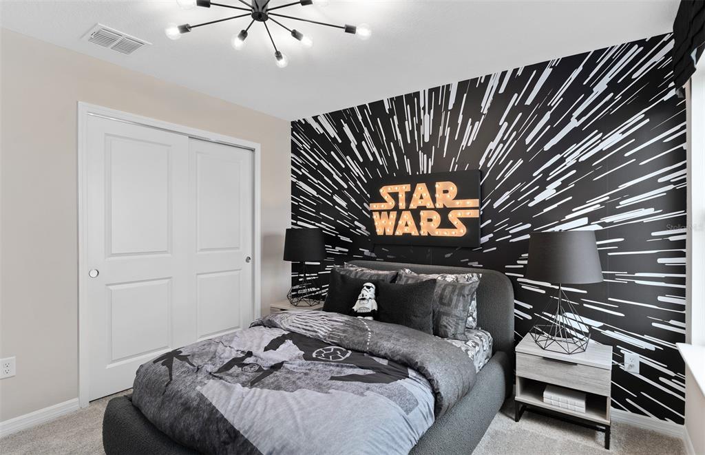 5013 Furrowed Way St. Cloud, FL 34771 - Photo 24 of 26 a bedroom with a bed and a ceiling fan