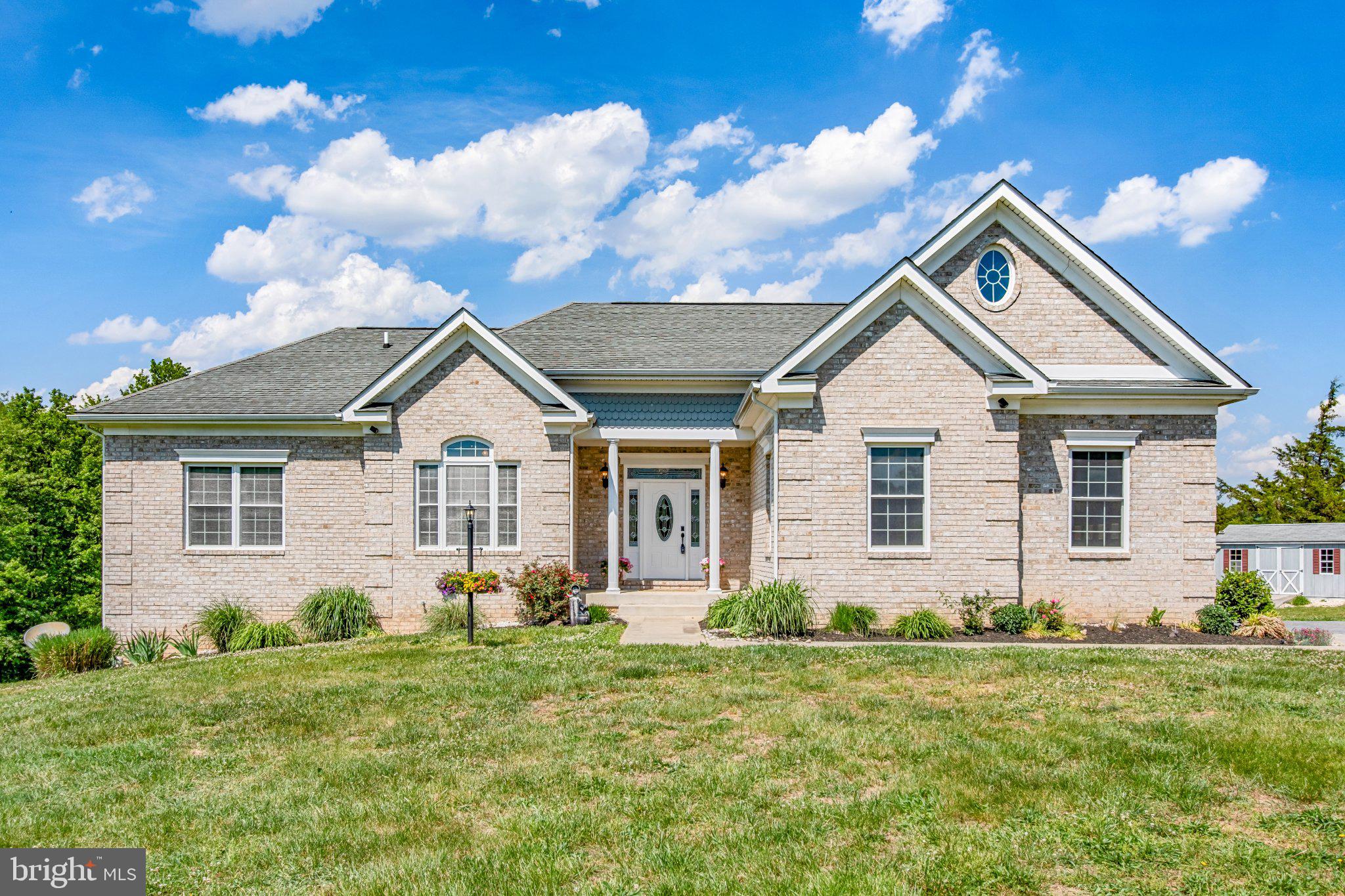 7147 Linganore Road New Market, MD 21774 - Photo 1 of 44 Charming brick home under blue skies.