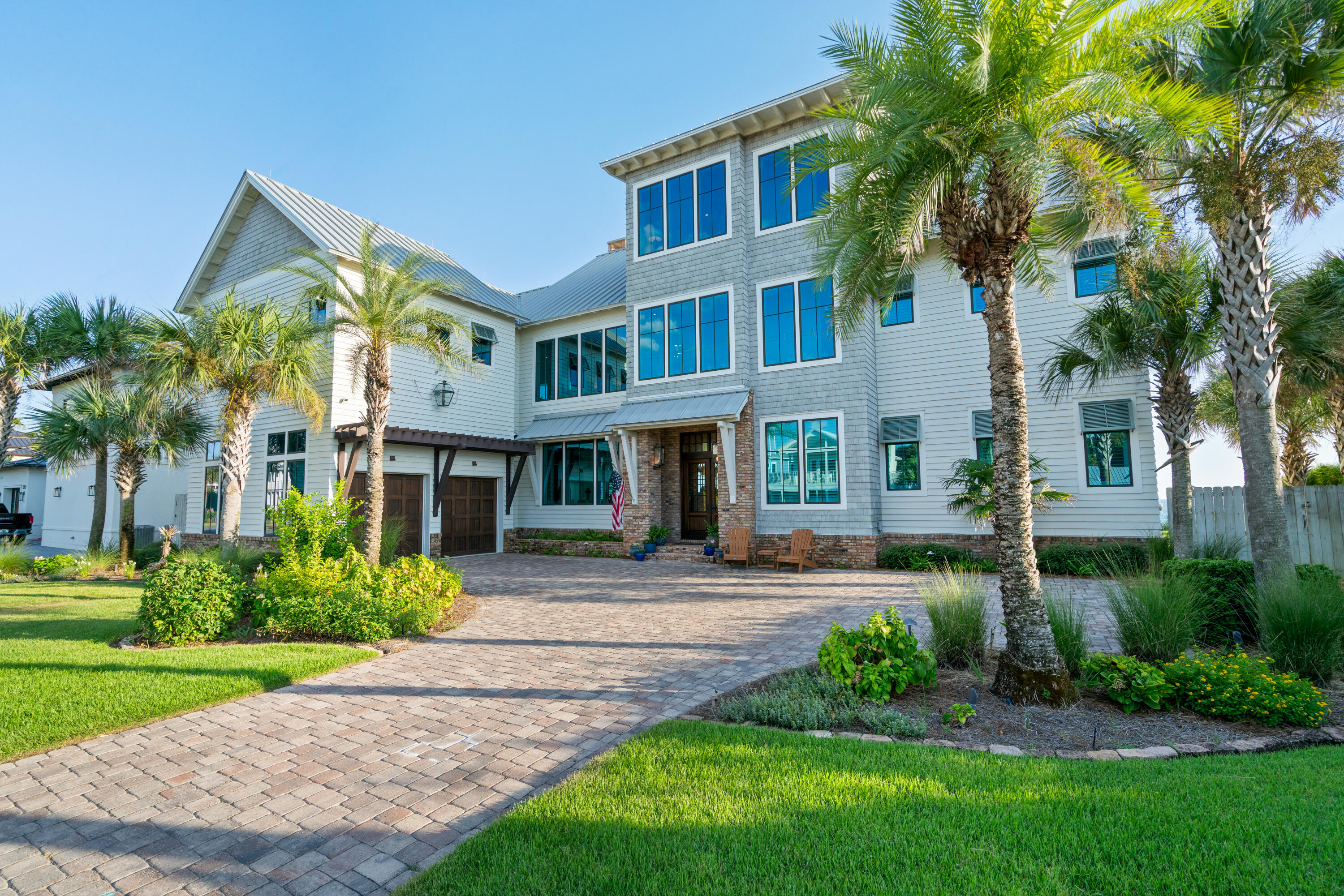 556 Blue Mountain Road Santa Rosa Beach, FL 32459 - Photo 13 of 72 a front view of a house with garden and trees