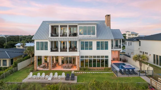 a front view of a house with a yard table and chairs