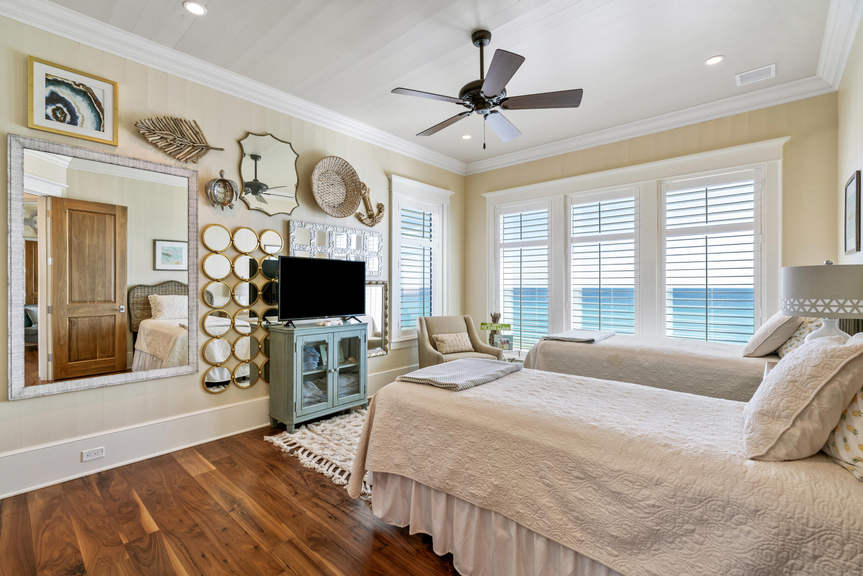 556 Blue Mountain Road Santa Rosa Beach, FL 32459 - Photo 42 of 72 a bedroom with a large bed and a flat tv screen on dresser
